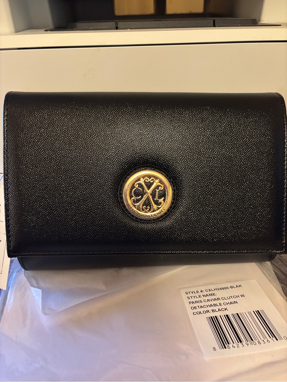 Christian Lacroix Black Leather Clutch with Gold Emblem and detachable chain.